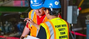 Team members wearing hard hats